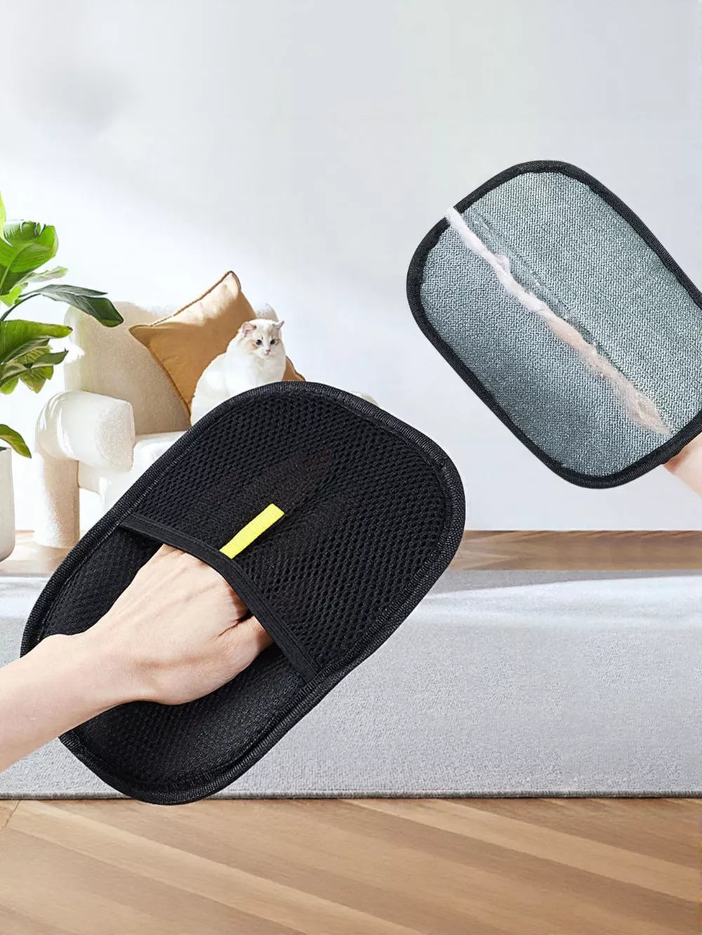 Supplier illustration of the grey working face and black mesh back of one hair-removal mitt; one mitt supplied.